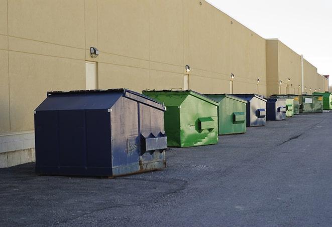 a stack of heavy construction dumpsters waiting to be emptied in Anoka